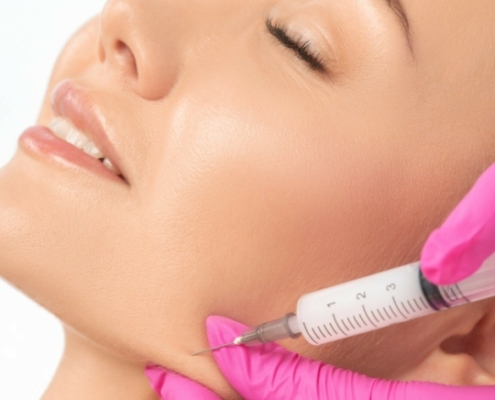 Cosmetologist makes lipolytic injections to burn fat on the chin